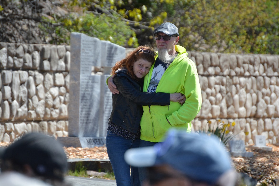 Tanya Hottel and Michael Koenig share an emotional hug during Dusty Ham's performance of his song, "91 Sons."