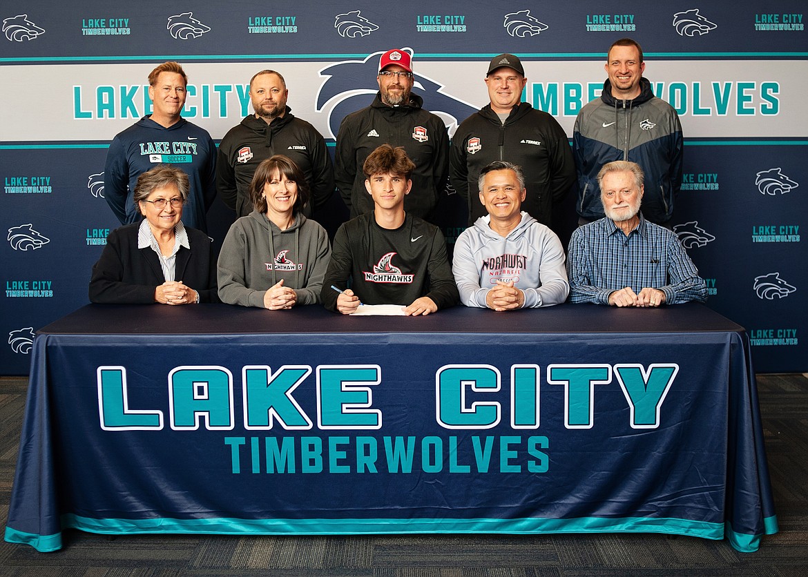 Courtesy photo
Lake City High senior Michael Chan recently signed a letter of intent to play soccer at NCAA Division II Northwest Nazarene University in Nampa. Seated from left are Kim Atkinson (grandmother), Jaime Chan (mother), Michael Chan, Zac Chan (father) and Dave Atkinson (grandfather); and standing from left, Kevin Jump, Lake City High head boys soccer coach; Matt Ruchti, club soccer coach; Nick Funkhouser, club soccer coach; Mike Thompson, club soccer coach; and Troy Anderson, Lake City High athletic director.