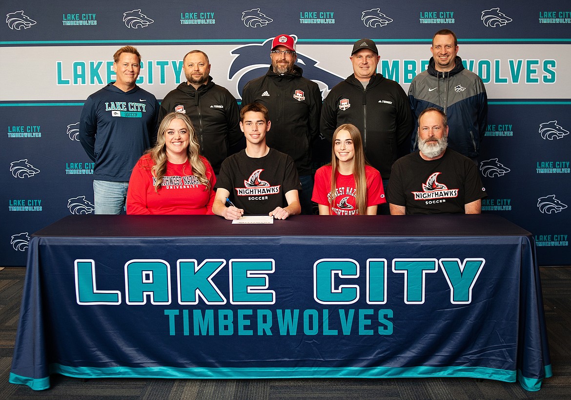 Courtesy photo
Lake City High senior Noah Waddell recently signed a letter of intent to play soccer at NCAA Division II Northwest Nazarene University in Nampa. Seated from left are Cathy Waddell (mother), Noah Waddell, Sloan Waddell (sister) and Brian Waddell (father); and standing from left, Kevin Jump, Lake City High head boys soccer coach; Matt Ruchti, club soccer coach, Nick Funkhouser, club soccer coach; Mike Thompson, club soccer coach; and Troy Anderson, Lake City High athletic director.