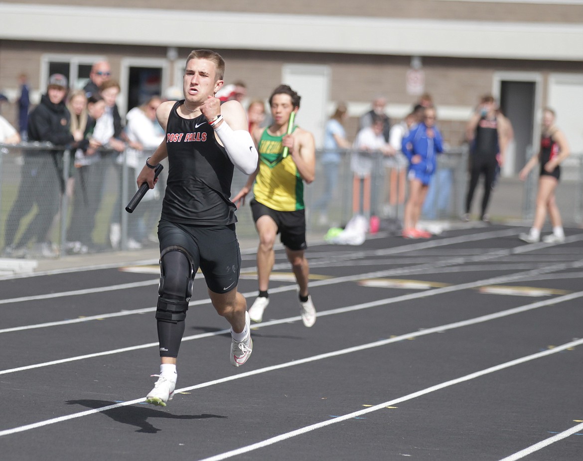 JASON ELLIOTT/Press
Post Falls High senior Dylan Wolfe tries to increase his lead during his leg of the boys 4x200 relay at the District 1 All-Star Meet at Post Falls High on Thursday. Post Falls won in a meet record 1 minute, 29.62 seconds.