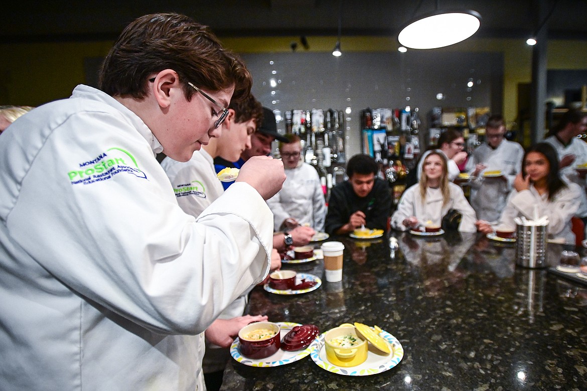 Glacier High School culinary students enjoy a dish of coddled eggs at Trovare during the students' tour of Whitefish eateries and restaurants on Friday, May 3. Each student was able to keep the dish the eggs were served in, a Mini Round Cocotte by Le Creuset. (Casey Kreider/Daily Inter Lake)