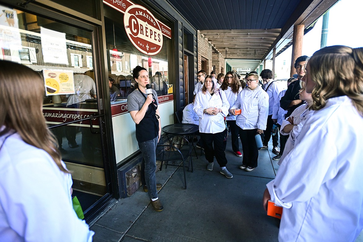 Sara Seed, owner of Amazing Crepes, speaks to Glacier High School culinary students outside her restaurant during the students' tour of Whitefish eateries on Friday, May 3. (Casey Kreider/Daily Inter Lake)