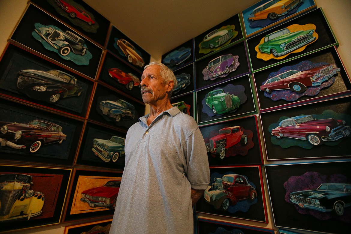 Hot rods, Volkswagens and even a Lamborghini are among the detailed 3D paintings of classic cars hanging in the Post Falls home of prolific artist Tim Scarola, seen here Friday morning. Nearly every wall of the home he shares with his wife Pat is adorned with his many creative pieces that vary in medium and range from animals and flowers to muscle cars and landscapes.