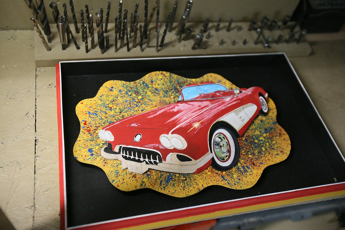 From plain wood to 3D art, this classic car painting will soon be attached to its splatter-painted background to create another unique piece in Tim Scarola's collection.