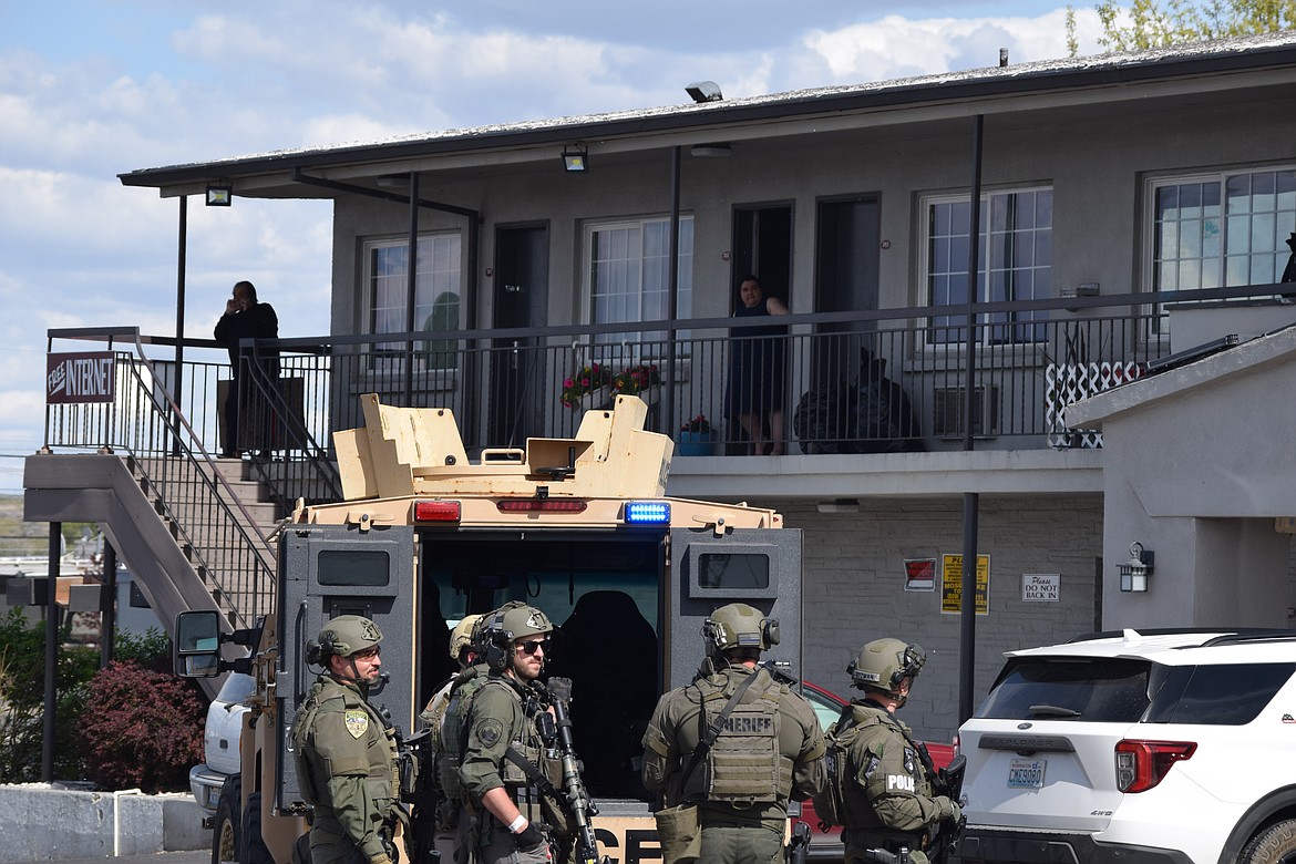 Spokane SWAT and Moses Lake Police Department officers on site at a raid at the old EconoLodge location between KFC and the Moses Lake Public Library Friday afternoon.