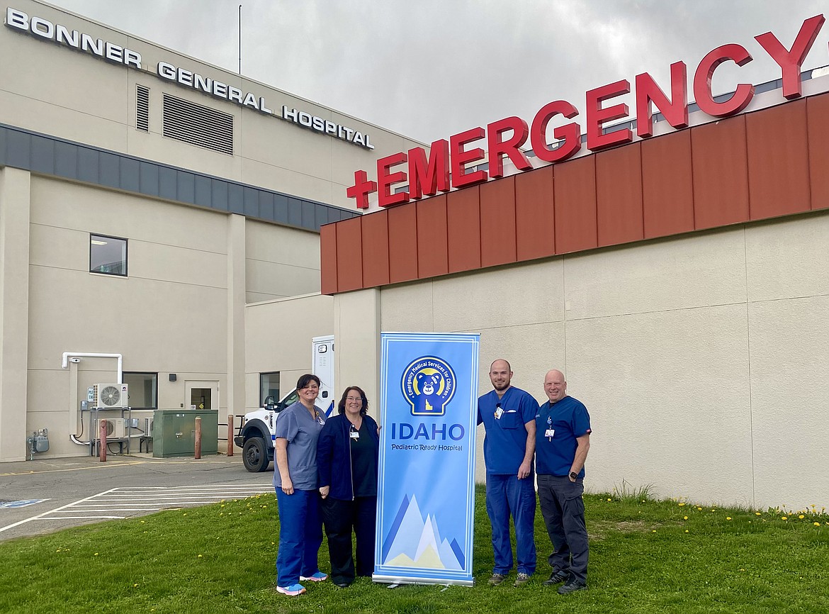 Bonner General Hospital Emergency Department staff are pictured with a banner recognizing the 25-bed critical access hospital as being ready for pediatric emergencies. Pictured, from left, are Lori Garza, Marian Martin, Ryan Kerouac, and Dr. Doug Dixon.