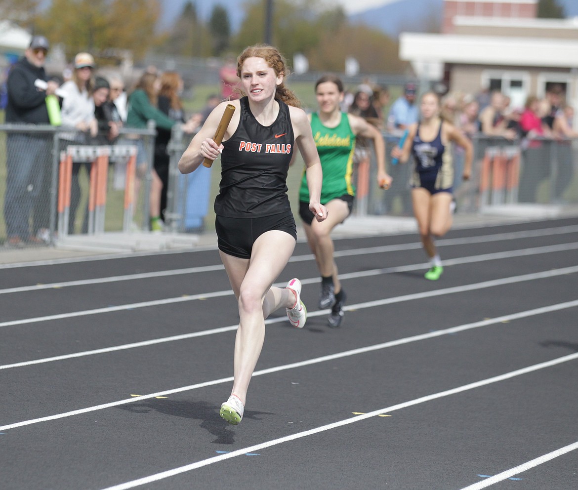 JASON ELLIOTT/Press
Post Falls High senior Kinlee McLean runs toward the finish line during the girls 4x200 relay at the District 1 All-Star Meet on Thursday at Post Falls High. McLean, who also competed in cross country and basketball, signed to run track at Boise State in December.