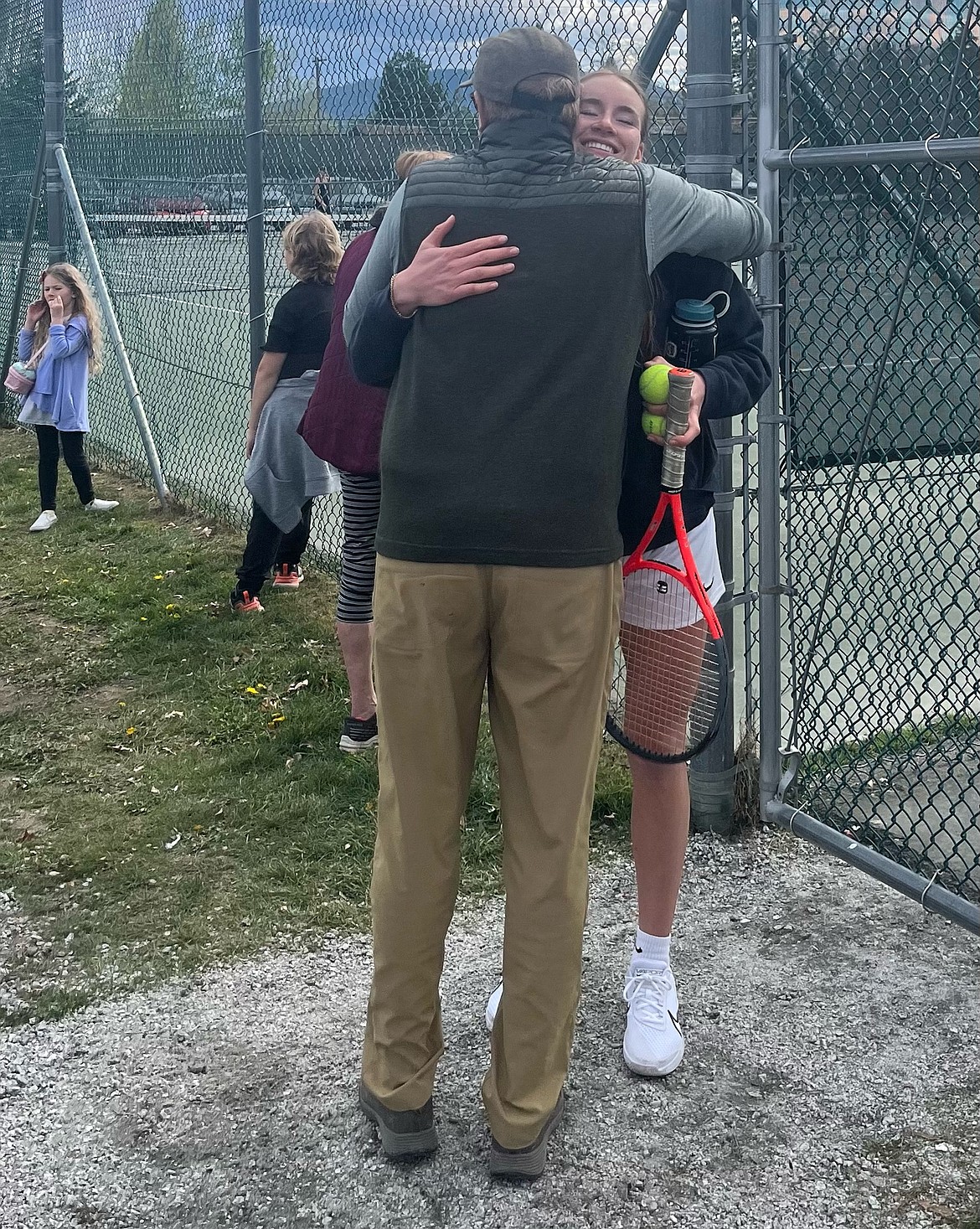 Sandpoint senior Neva Reseka gets a victory hug from her father, David Reseska, after a big win against Moscow on Thursday.