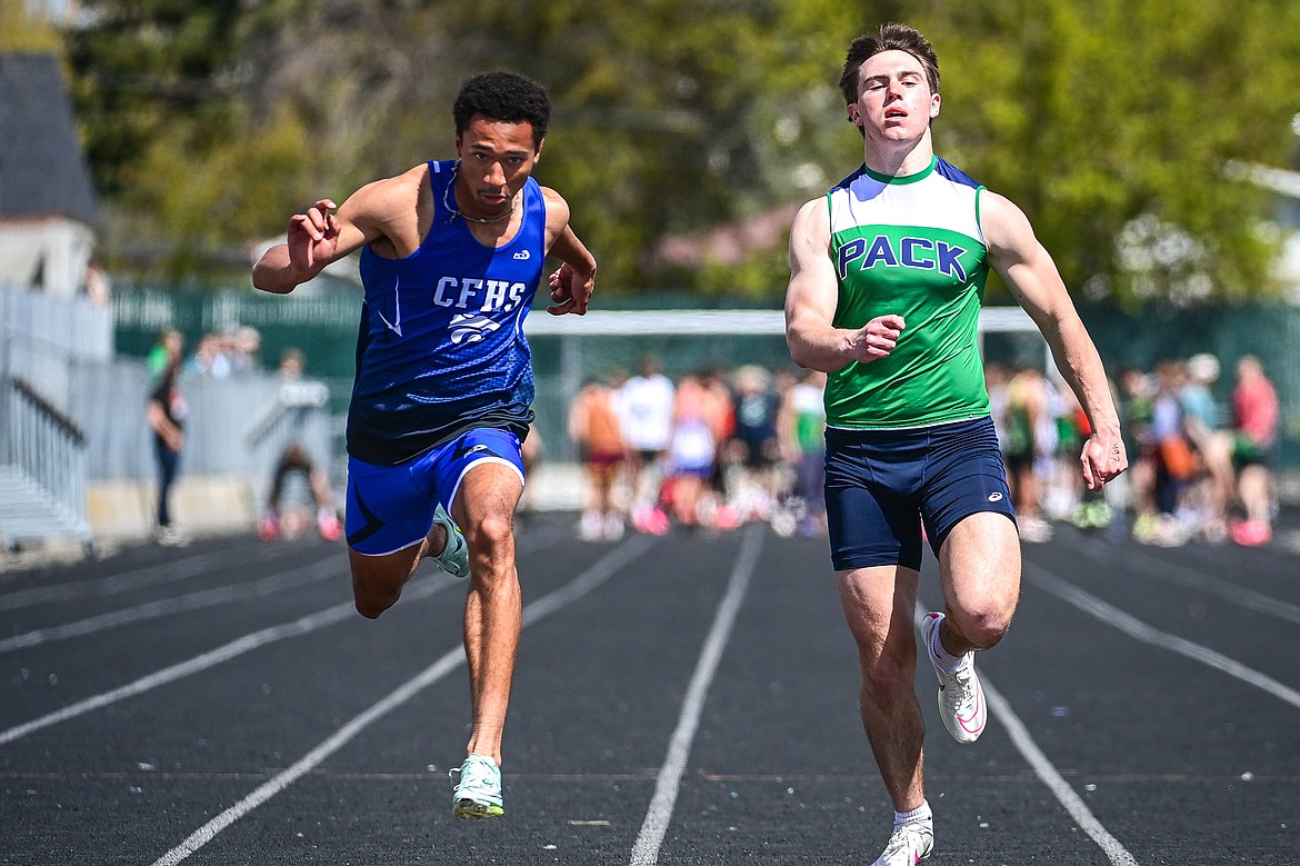 Columbia Falls' Malaki Simpson leans in at the finish line for a first-place finish in the boys 100 meter run at the Archie Roe Invitational at Legends Stadium on Saturday, May 4. (Casey Kreider/Daily Inter Lake)