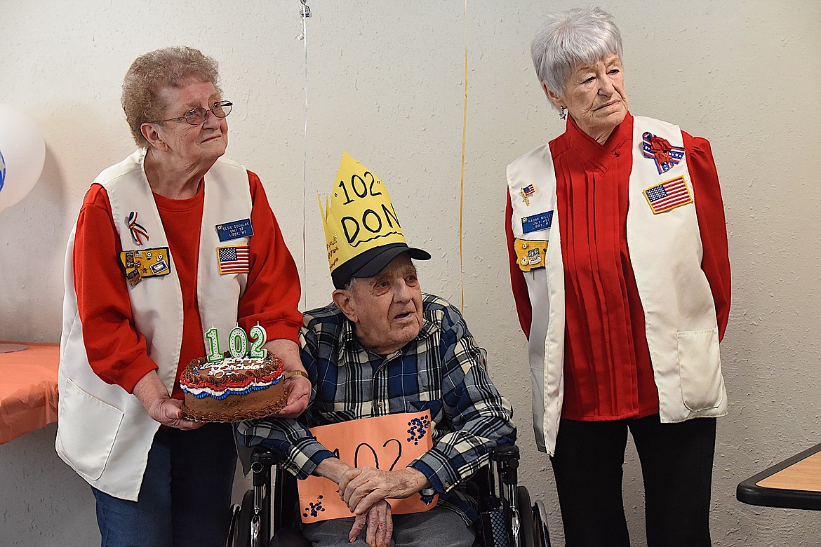 Elsie Douglas, Don Engel and Naomi Miller listen to Bill LaFrance speak at Engel's 102nd birthday party Thursday, May 2, 2024, at the Care Center. (Scott Shindledecker/The Western News)