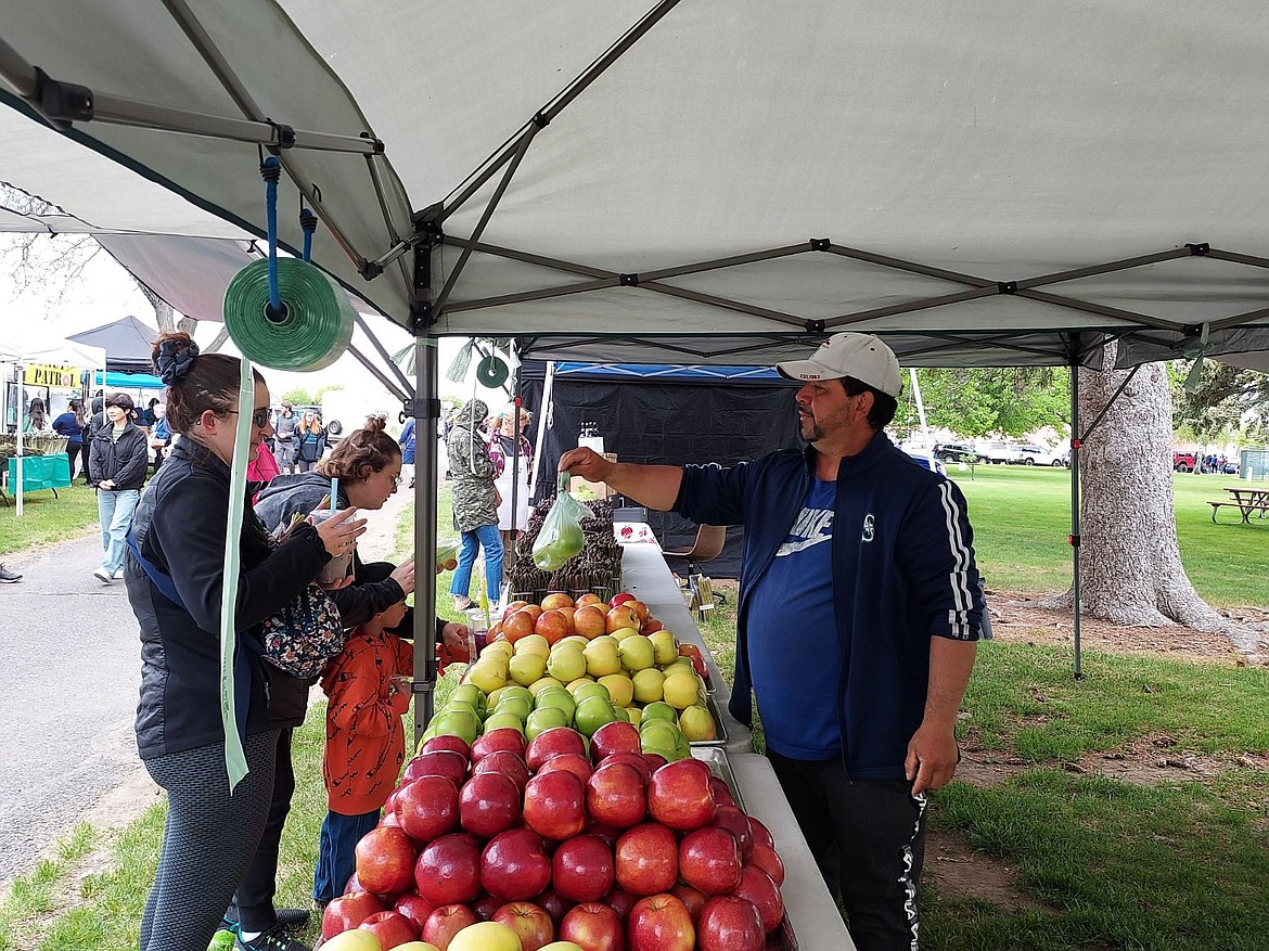 Despite drizzly weather customers came to check out the offerings at the first outdoor Moses Lake Farmers Market of the year.