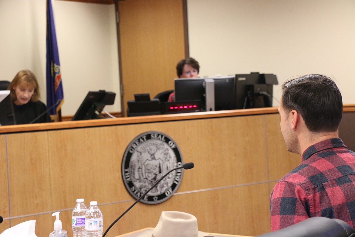 C. Banjo Patterson (played by Sandpoint High School teacher Conor Baranski) listens as Magistrate Judge Lori Meulenberg presides during the initial appearance portion of a mock trial held as part of a Law Day education event for Sandpoint High School government teachers.