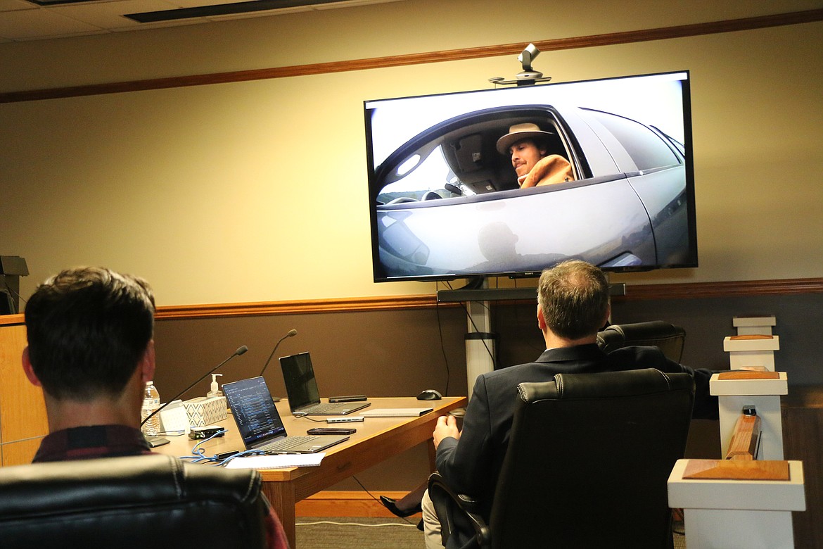 C. Banjo Patterson (played by Sandpoint High School teacher Conor Baranski) and Bonner County Prosecutor Louis Marshall watch as a bodycam video is played of a mock traffic stop as part of a Law Day education event for Sandpoint High School government teachers.
