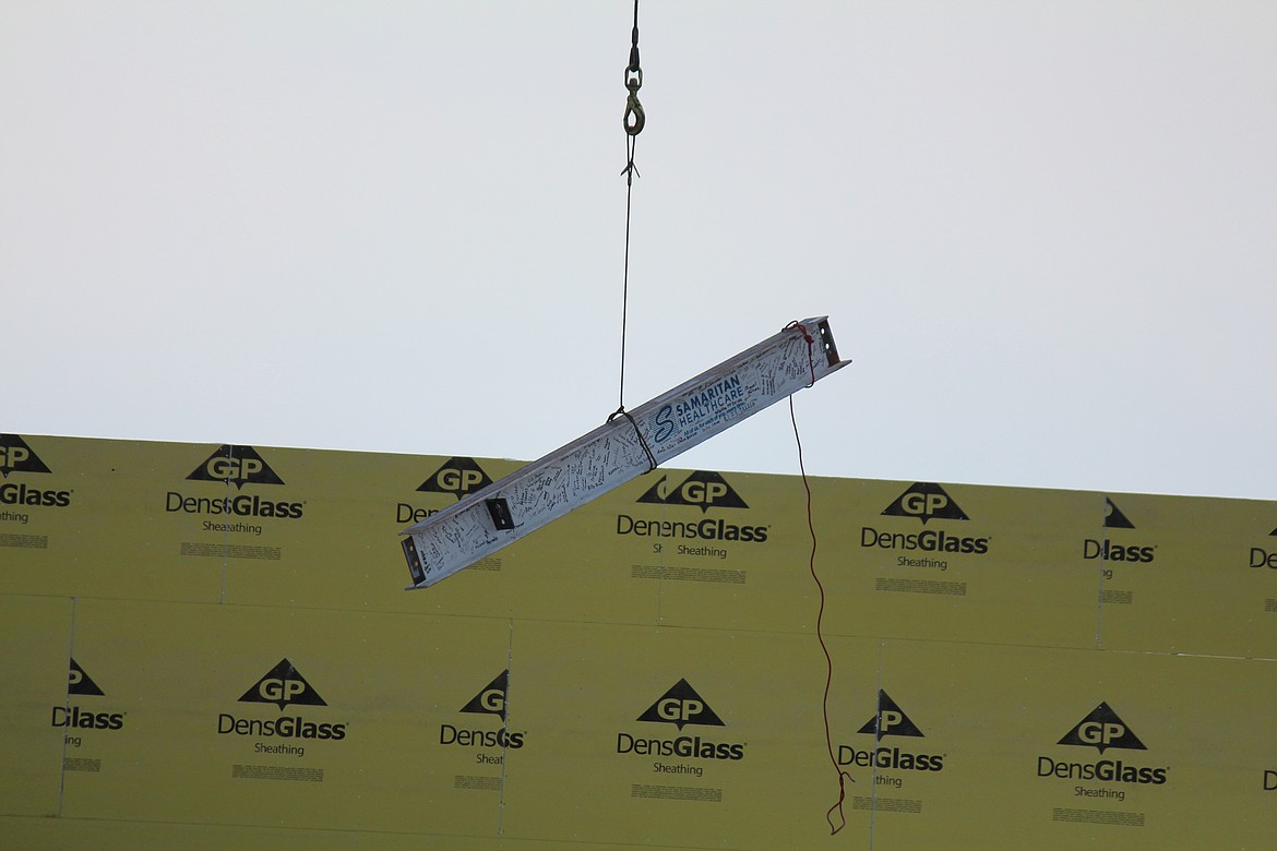 Signaling the end of the first phase of construction, the last piece of steel framing at the new Samaritan Hospital is lifted into place.