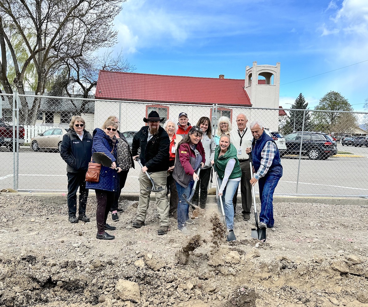 Friends and family of Dave Stipe joined Lake County Courthouse staff last Tuesday to celebrate groundbreaking on the new courthouse annex, named after Stipe. Wielding shovels in the front row are members of the Stipe family – Debbie May, Kevin May, Susan Peterson and Taylor Stipe – with Commissioner Bill Barron. Pictured in the back row are Donna Hook, Connie Slocum, Billie Lee, Don Bick, Toni Kramer, Punk Kerr and Commissioner Gale Decker. (Kate Stinger photo)