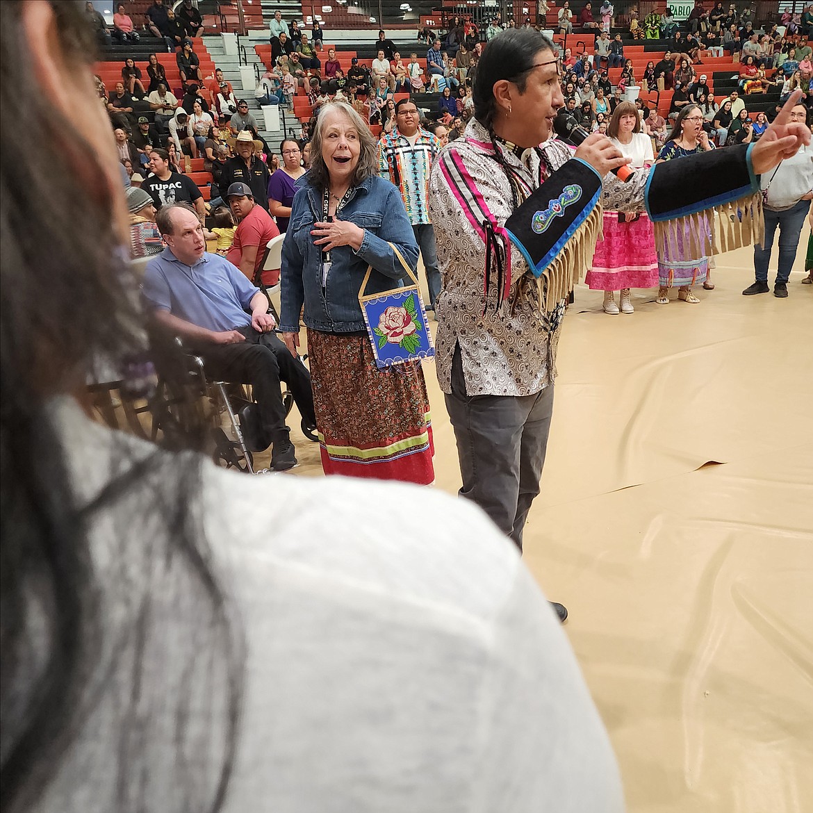 The audience waits for the Mission Valley Honor Guard, the elders, and the Head Man and Head Woman dancers to enter the Ronan Event center for the Head Start Powwow on Friday evening. (Berl Tiskus/Leader)