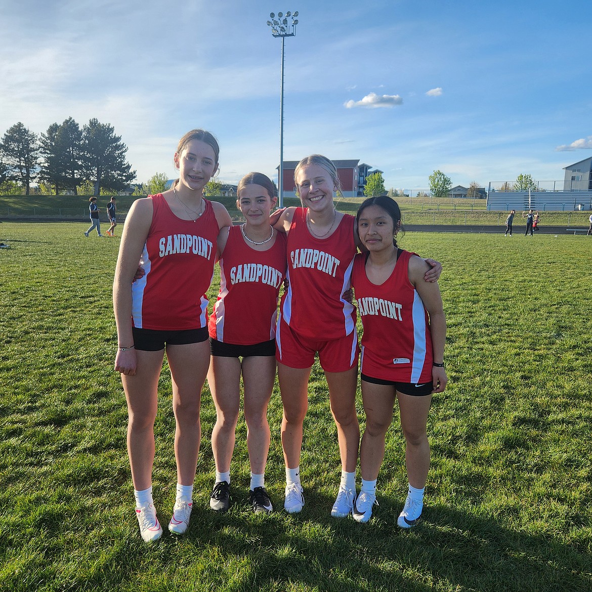During a meet at Lake City High on Friday, from left, Carlee Klippel, Leah Kerfoot, Raelyn Olsen, and Mei Viloria broke the Sandpoint Middle School girls 4x100 relay record and finished first with a time of 54.13 seconds. The SMS track and field team will compete at the middle school district championships set to be held Thursday at Lakeland High.