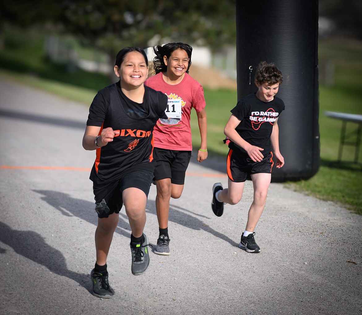 And they're Off! Brothers Joey Matt, Sonny Matt and Abram Boyd start the 10K race at the Dixon Stampede. (Tracy Scott/Valley Press)