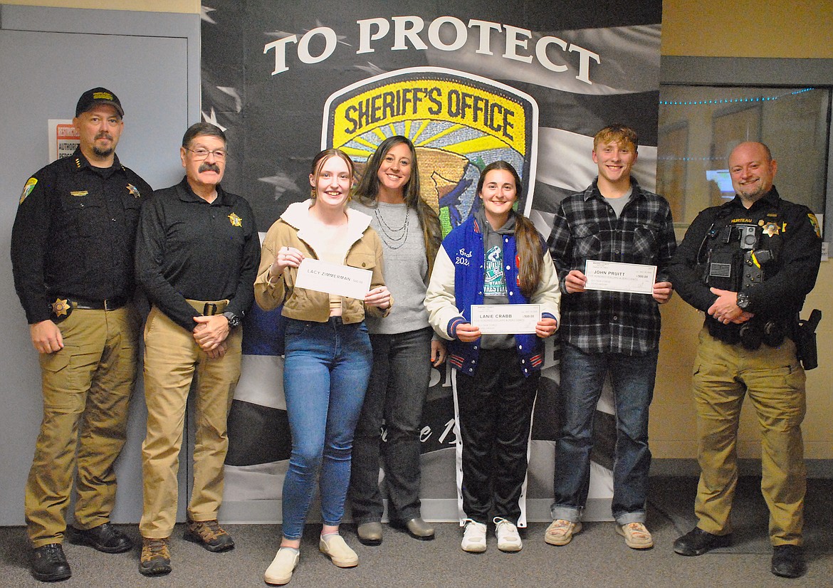 From left, Mineral County Sheriff Ryan Funke, DUI Task Force member Ernie Ornelas, Alberton scholarship recipient Lacey Zimmerman, Task Force member Stephanie Quick, Lanie Crabb from Superior High School, John Pruitt from St. Regis High School, and Deputy and DUI Task Force Coordinator Matthew Hurteau. (Mineral Independent/Amy Quinlivan)