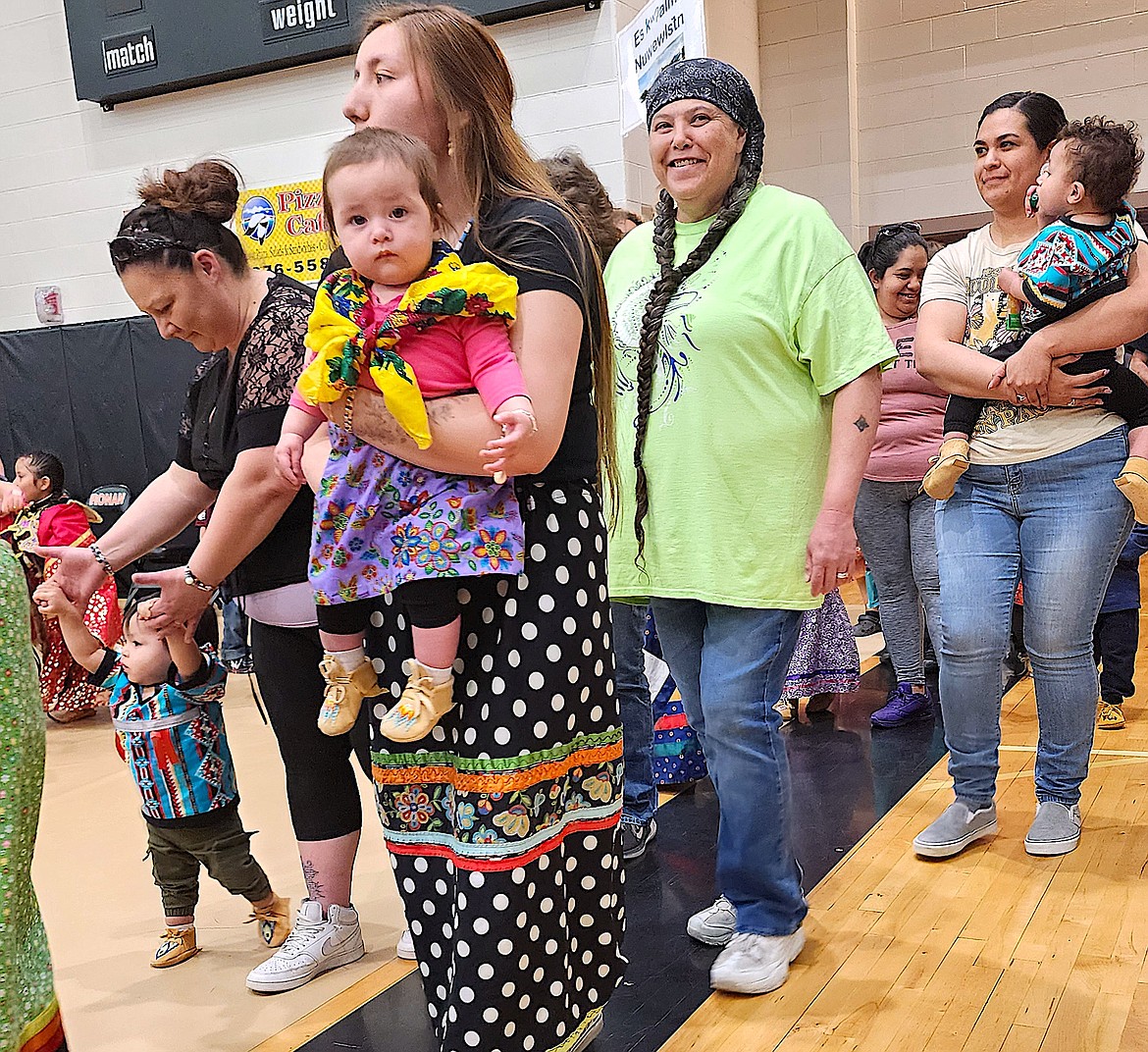 Young powwow dancers, some barely walking, participate in the grand entry at the Head Start Powwow. (Berl Tiskus/Leader)
