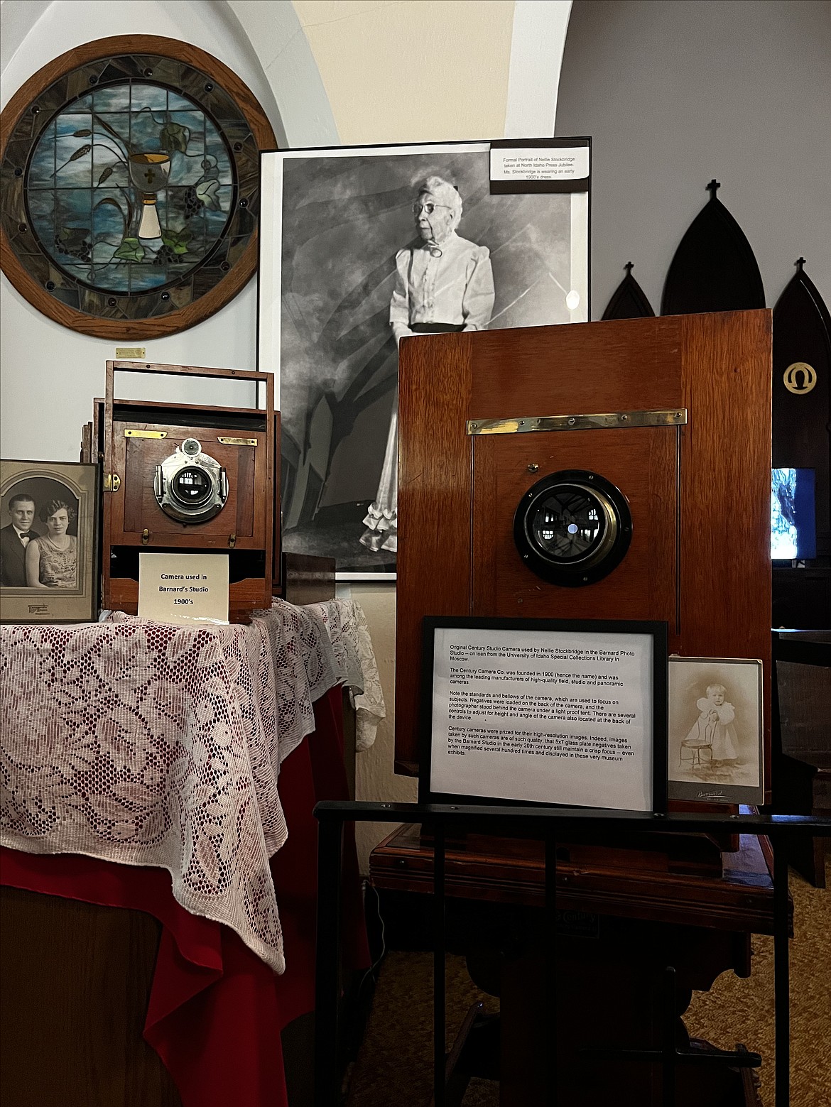 These cameras, used by Nellie Stockbridge and T.N. Barnard in their Wallace studio, are on display at the Barnard-Stockbridge Museum. Stockbridge can be seen pictured in the background.