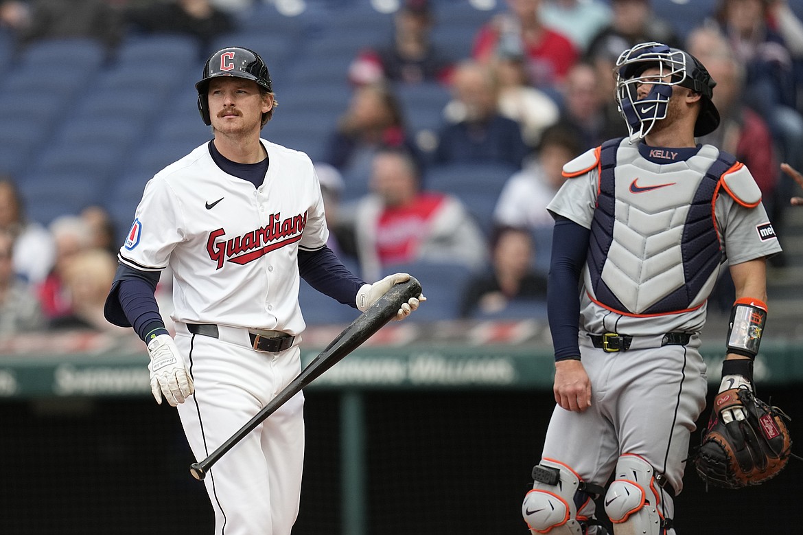 SUE OGROCKI/Associated Press
Kyle Manzardo of the Cleveland Guardians, the former Lake City High star, reacts after striking out in his first major league at-bat as Detroit Tigers catcher Carson Kelly looks on in the second inning Monday in Cleveland.