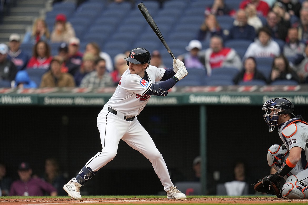 SUE OGROCKI/Associated Press
Kyle Manzardo of the Cleveland Guardians, the former Lake City High and Washington State standout, takes his first major league at-bat in the second inning against the Detroit Tigers on Monday in Cleveland. Tigers catcher Carson Kelly is at right.