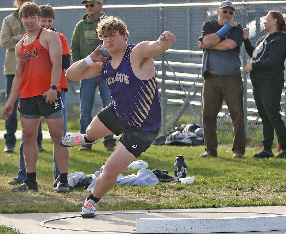 Polson Astin Brown shows off winning form in the shot put, placing first in that event as well as the discus during last Thursday's track meet in Ronan. (Bob Gunderson photo)