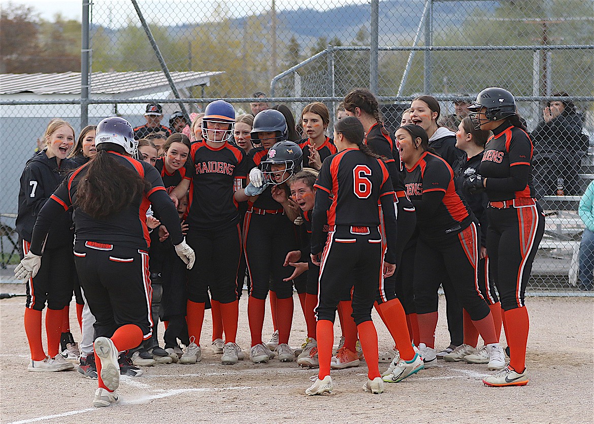 Ronan celebrates another home run by Nevaeh Perez during last week's game against Polson. (Bob Gunderson photo)
