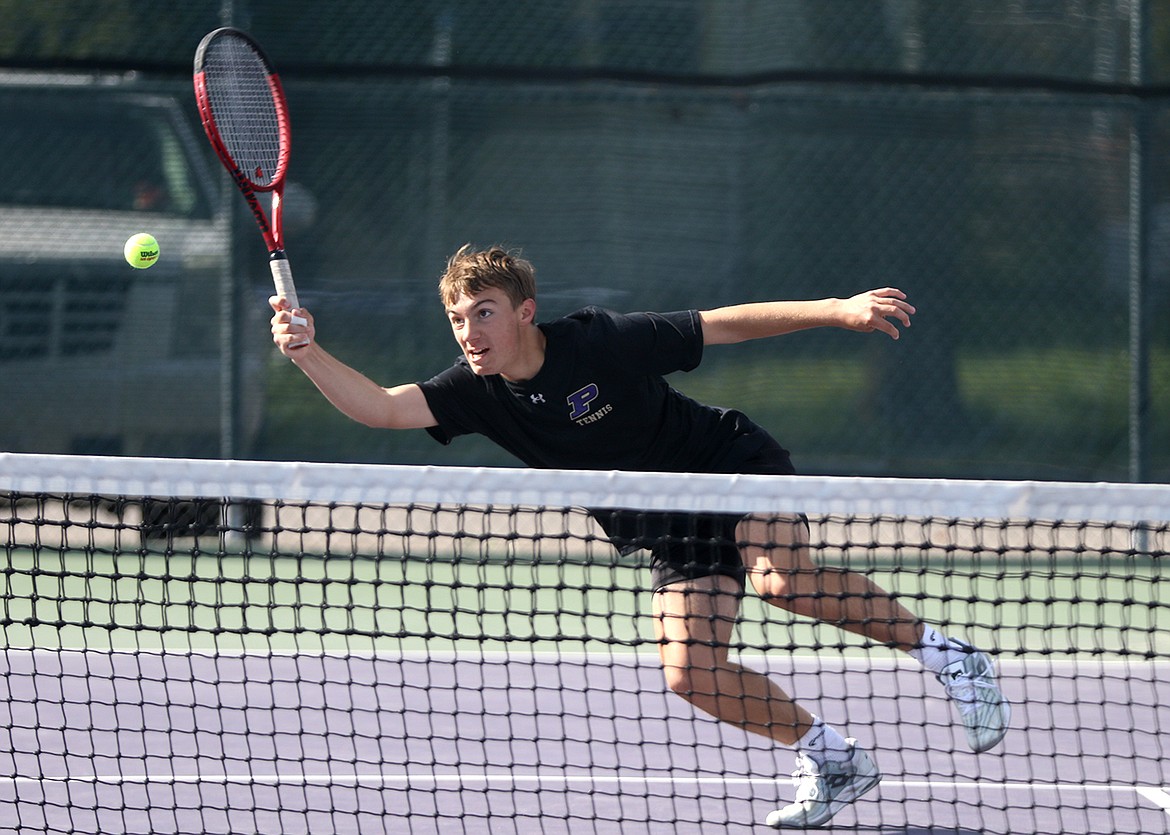 Polson's Ruger Ellis stretches in doubles play Saturday against Bigfork. (Bob Gunderson photo)