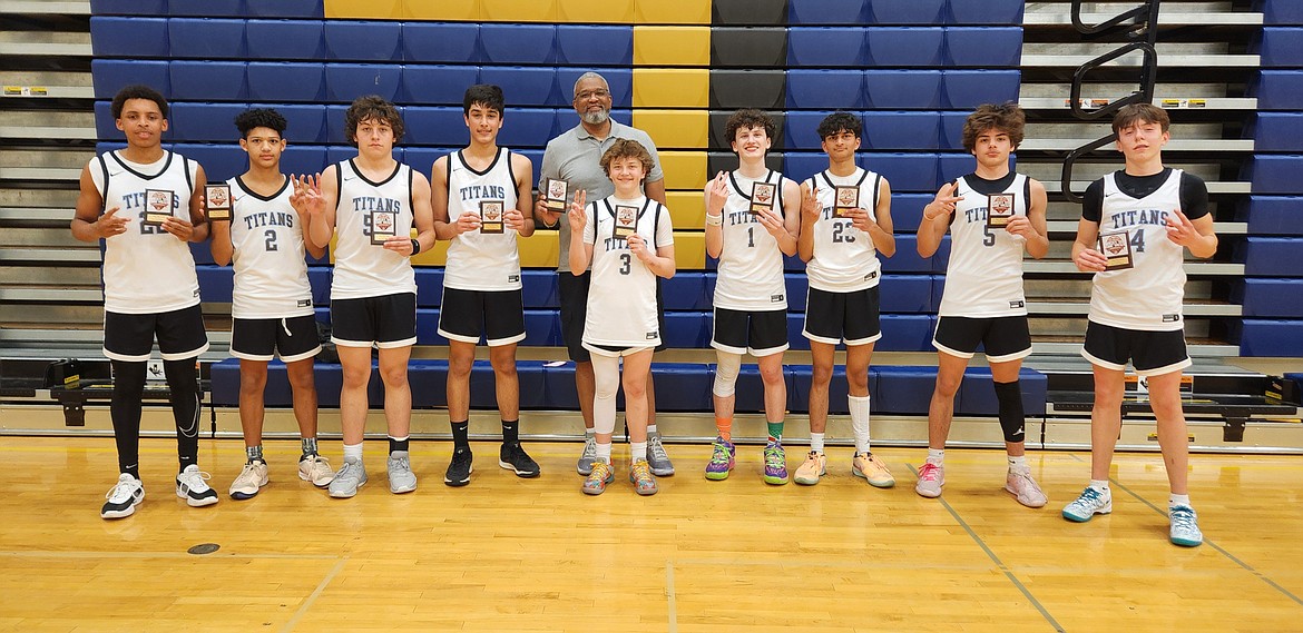 Courtesy photo
The Titans AAU boys basketball team took second place in the ninth grade division on Sunday at the Best in the West Tournament in Yakima, Wash. From left are Miles Spencer, JaKolbe Lopp, Rex Arroyo, Arjuna Kandola, coach Leon Sayers, Sawyer Norisada (Post Falls), Wallace Frates, Vihaan Rajeev, Makya Quincy (Post Falls) and Evan Drew.