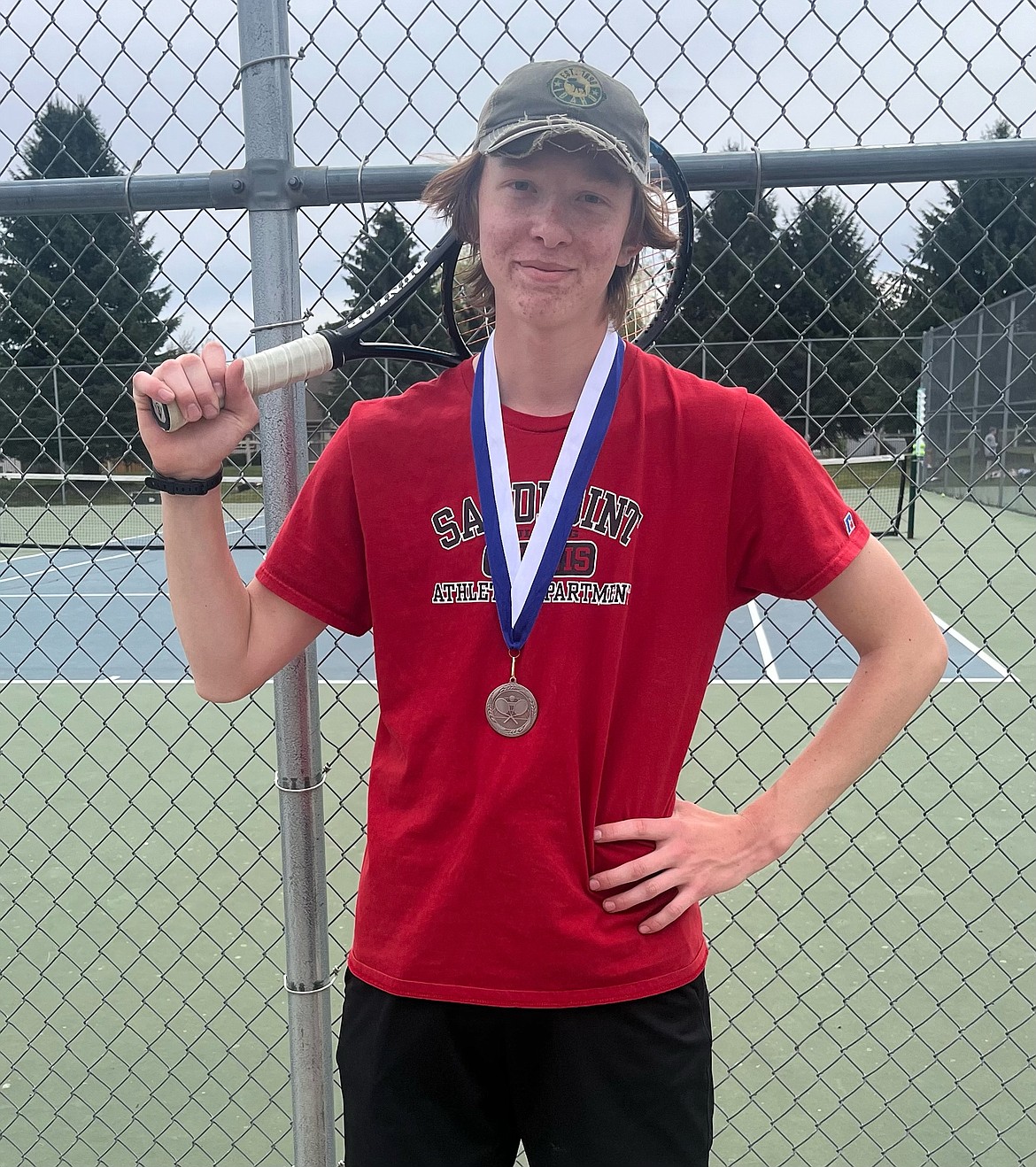 Sandpoint's Austin Leonard shows off his second-place medal from the junior varsity district championships.