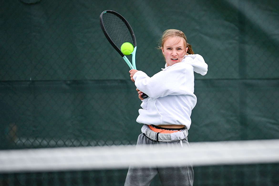 Flathead's Sarah Loran hits a return in a girls singles match against Glacier's Miley Fritz at Flathead Valley Community College on Tuesday, May 7. (Casey Kreider/Daily Inter Lake)