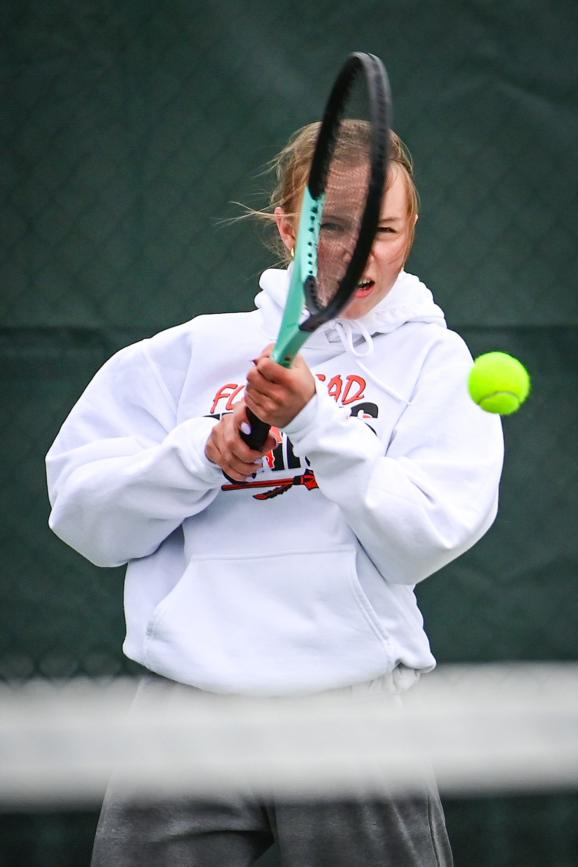 Flathead's Sarah Loran hits a return in a girls singles match against Glacier's Miley Fritz at Flathead Valley Community College on Tuesday, May 7. (Casey Kreider/Daily Inter Lake)