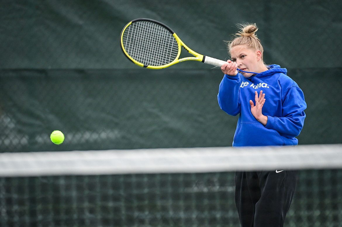 Glacier's Miley Fritz hits a return in a girls singles match against Flathead's Sarah Loran at Flathead Valley Community College on Tuesday, May 7. (Casey Kreider/Daily Inter Lake)