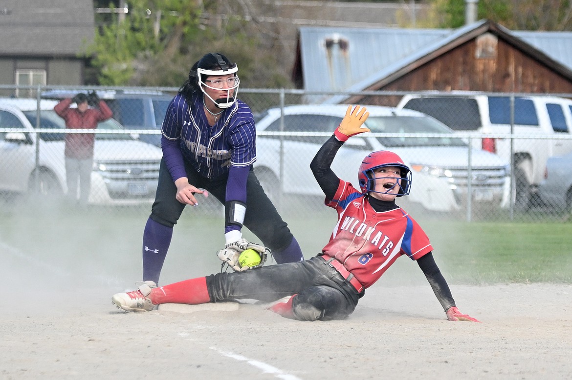 Tayler Lingle celebrates sliding safe for a triple. (Avery Howe photo)