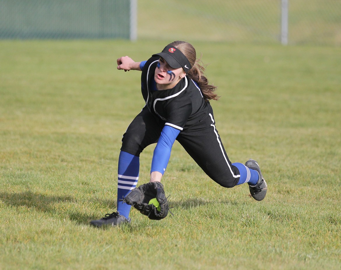 MARK NELKE/Press
Coeur d'Alene right fielder Morgan Knutson makes a lunging, diving, rolling catch of a sinking liner in the sixth inning of the 5A Region 1 softball championship game against Lewiston on Tuesday at Coeur d'Alene High.