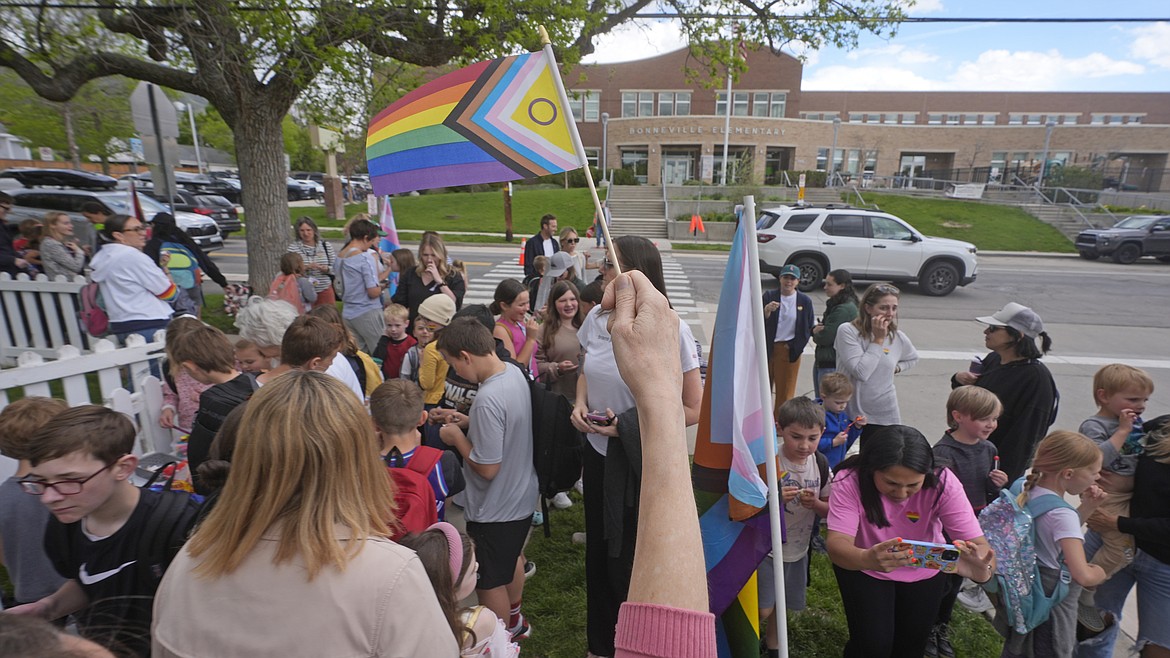 Bonneville Elementary School parents and students gather during a block party supporting trans and non binary students and staff on April 29, 2024, in Salt Lake City. Transgender activists have flooded a Utah tip line created to alert state officials to possible violations of a new bathroom law with thousands of hoax reports in an effort to shield trans residents and their allies from any legitimate complaints that could threaten their safety. (AP Photo/Rick Bowmer, File)