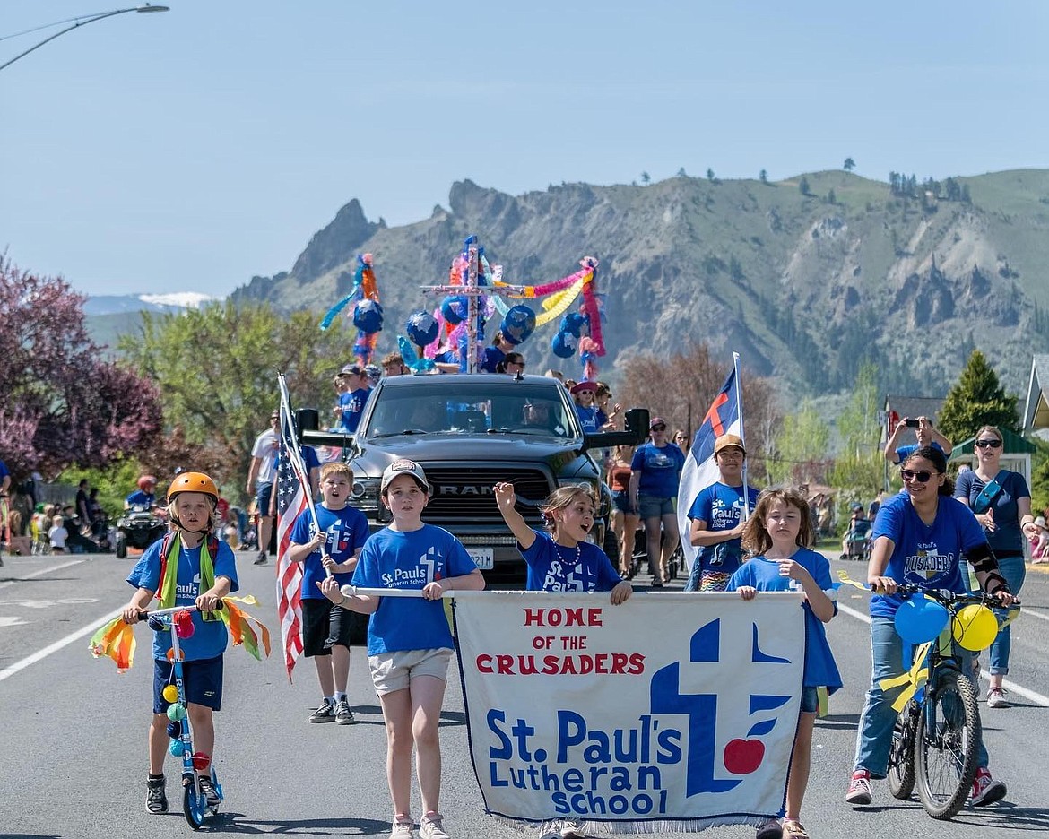 Students from St. Paul’s Lutheran School make their way through the 2023 Apple Blossom youth parade.