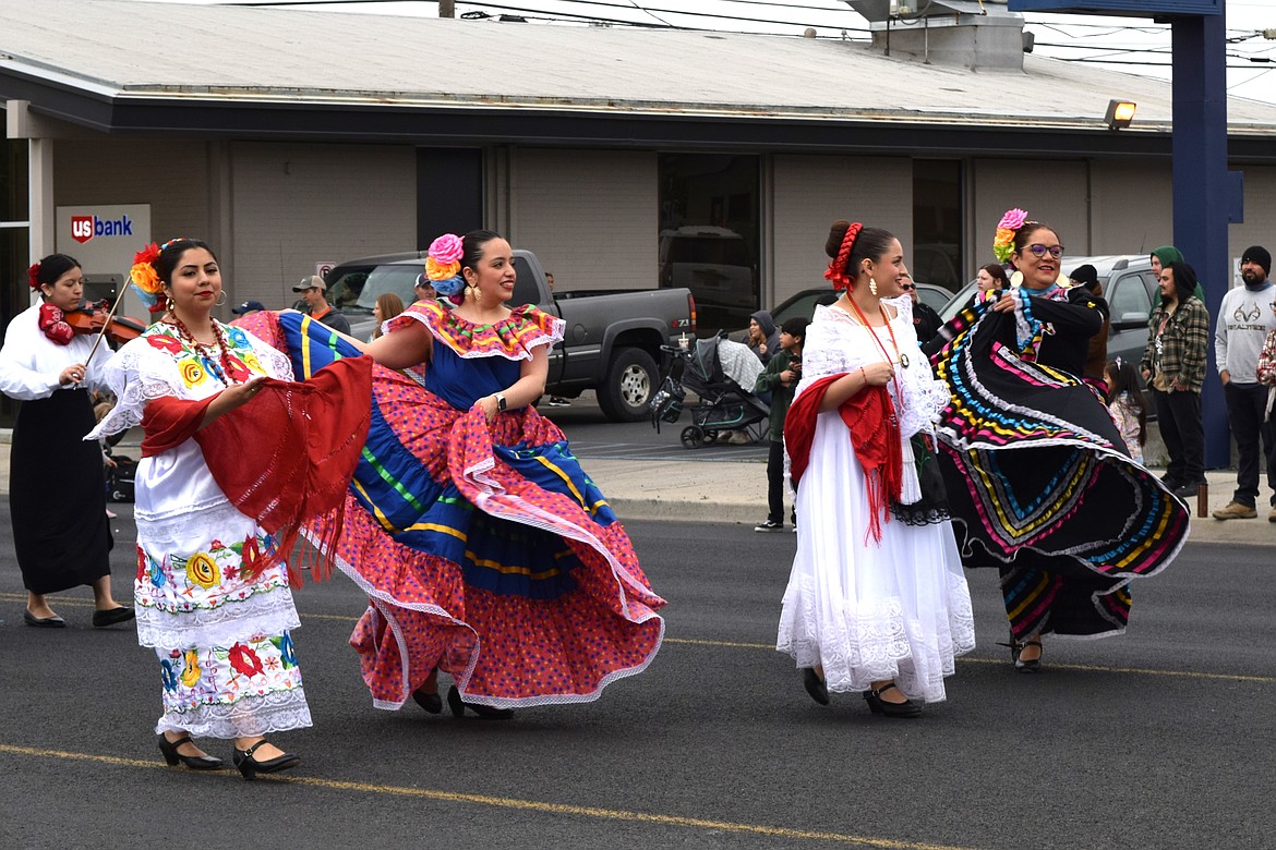 Dancers lead the Cinco de Mayo section of the parade down Othello’s Main Street Saturday morning, which was shared with teams from Othello’s opening day of Little League.