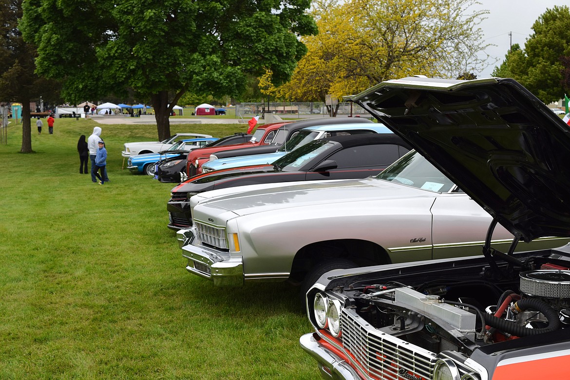 A row of cars at Saturday’s Othello Cinco de Mayo celebration line a section of Lion’s Park for community members to appreciate during the event’s car show.