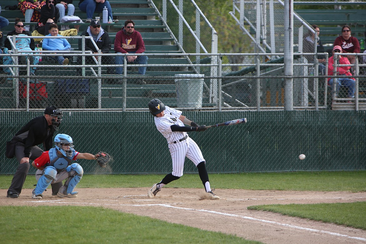 Moses Lake junior Cruz Martinez makes contact with a pitch during the Mavericks’ April 30 win over West Valley (Yakima).