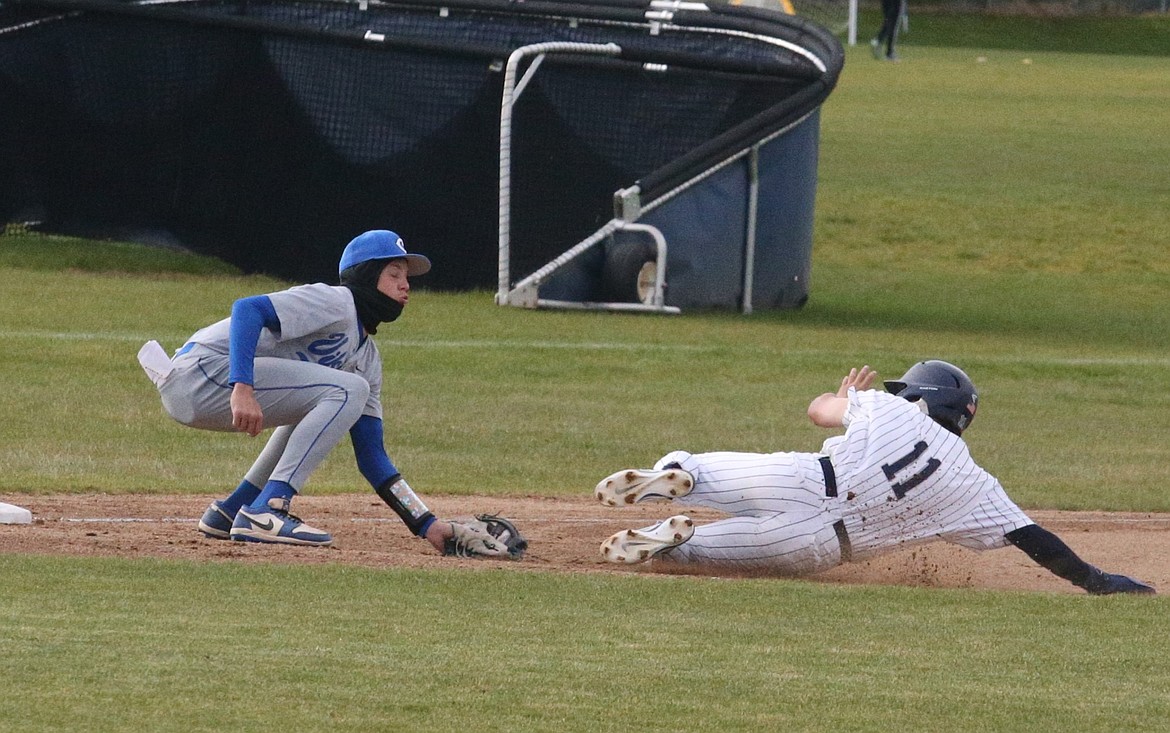 JASON ELLIOTT/Press
Coeur d'Alene sophomore third baseman Bam Fenter tags Lake City senior outfielder Ty Shepard out in the fourth inning of Friday's 5A Region 1 baseball championship game at Lake City High.