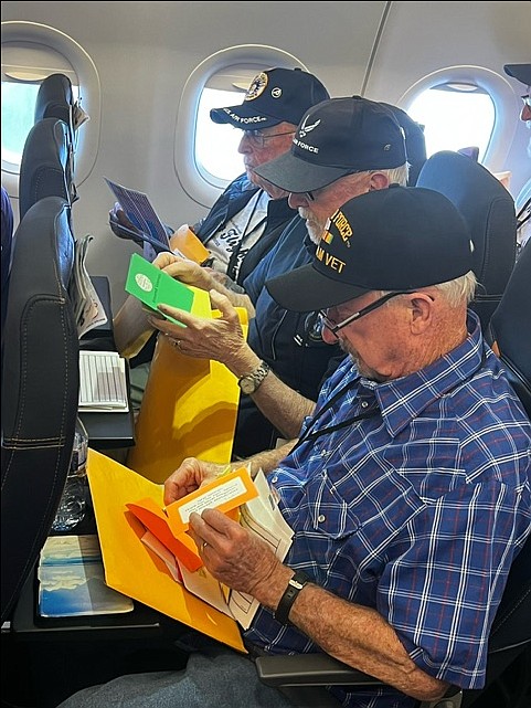 Bill Deacon, Joe Deacon and Tom Deacon read heartfelt letters from family members on their Honor Flight trip back from Washington D.C.