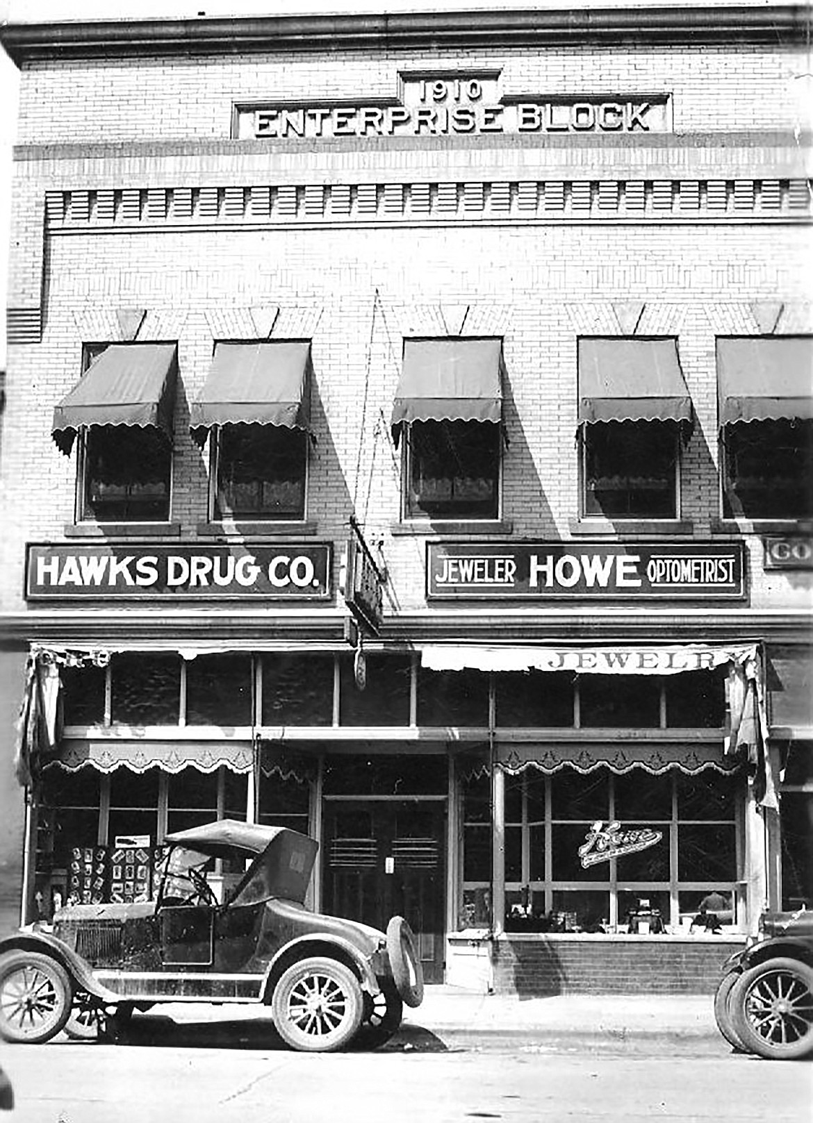 A photo of the building where O.F. Howe operated a jewelry business. Howe, also an optician, had a fine stock of jewelry, and did “all kinds of watch, clock, and jewelry repairs."