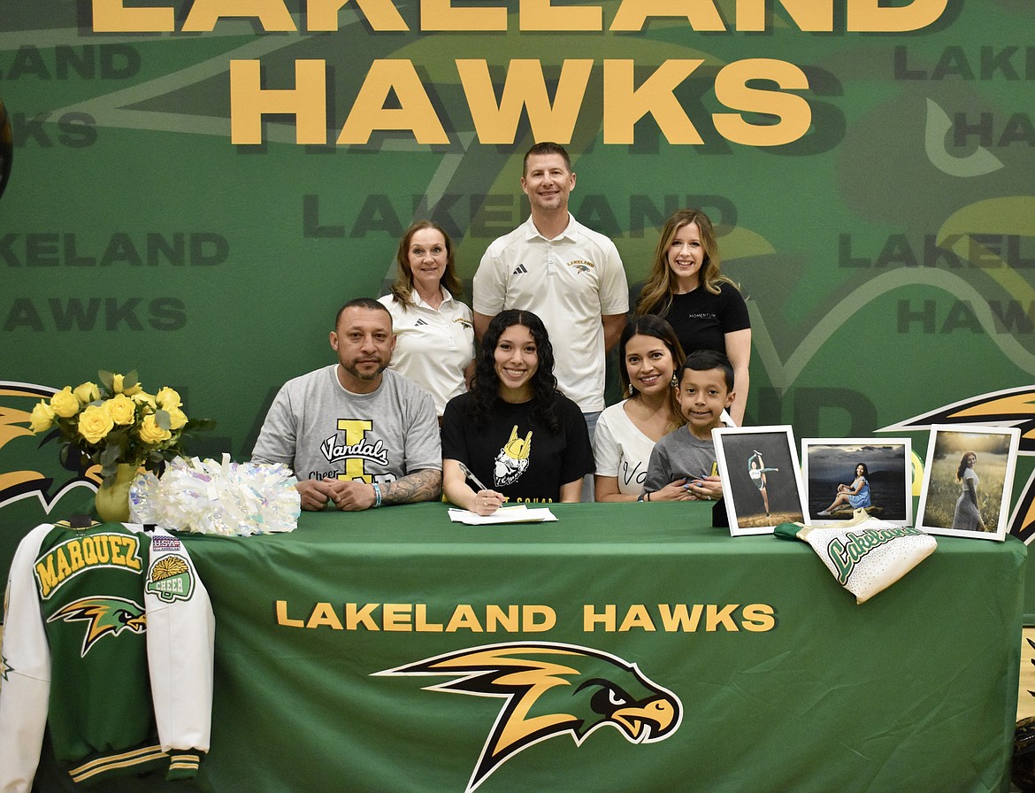 Lakeland High School senior Mia Marquez has signed with the University of Idaho Dance Team. Front row, from left: Father Jose Marquez, Mia Marquez, mother Laura Ochoa and brother Isaac Marquez. Back row, from left: Lakeland head dance coach Laura Kelly, Athletic Director Matt Neff and dance coach Katie Terra.