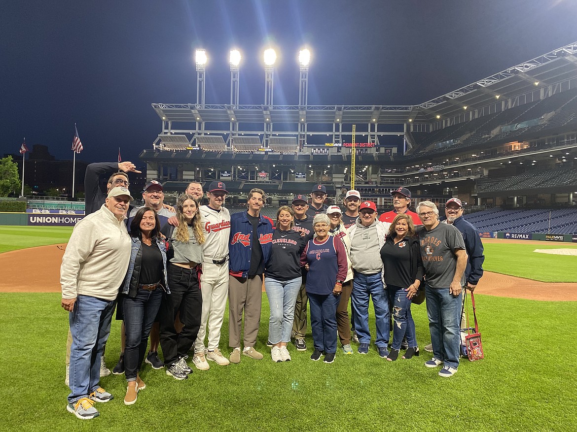 Courtesy photo
Family and friends gathered in Cleveland this week to watch the major league debut of Kyle Manzardo, the former Lake City High and Washington State star. The group posed on the field at Progressive Field after Kyle's debut Monday night. In the front row from left are Randy Rowley, Denise Pechette, Torrey Long, Kyle Manzardo, Marcus Manzardo, Windy Manzardo, Paul Manzardo, Janet Manzardo, Sherry Green, Mike Manzardo, Michelle Manzardo, Matt Manzardo and Kevin Rinaldi; and back row from left, Jared Pechette, Donny Gay, Brandon Gay, Brody Barnum, Owen Leonard and Art Green.