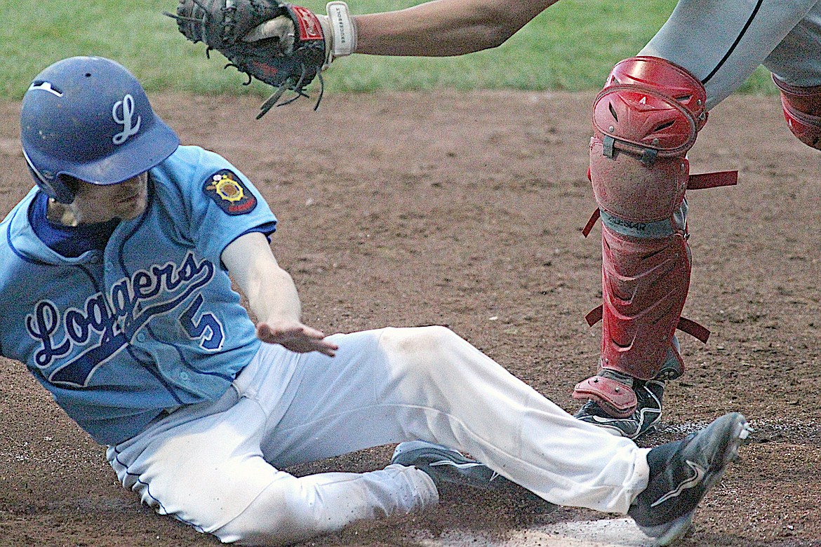 Libby's Noah Gillespie scores on an Aidan Rose sacrifice fly in the bottom of the seventh inning Wednesday, May 8, 2024, at the Lumberyard. The Lakers won 19-5. (Paul Sievers/The Western News)