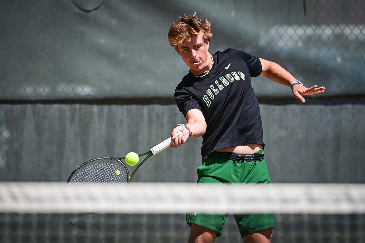 Whitefish's Dane Hunt hits a return in a boys doubles match with teammate Mason Kelch against Bigfork at Riverside Park in Whitefish on Thursday, May 9. (Casey Kreider/Daily Inter Lake)
