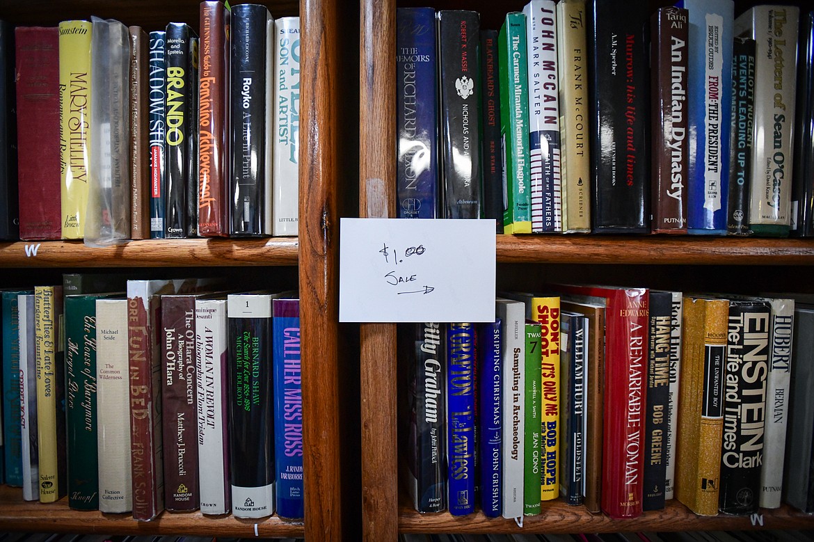 Part of a shelf of books on sale for $1 at Parkland Books on Wednesday, May 8. (Casey Kreider/Daily Inter Lake)